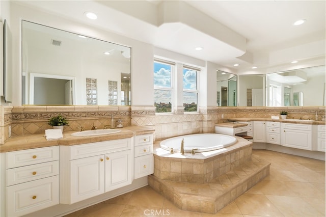 20112 Via Cellini, Porter Ranch, CA 91311 - bathroom with tile patterned flooring, decorative backsplash, recessed lighting, a bath, and vanity