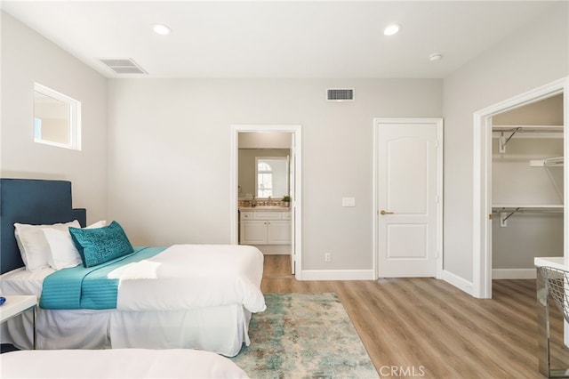 20112 Via Cellini, Porter Ranch, CA 91311 - bedroom with light wood-type flooring, recessed lighting, a spacious closet, baseboards, and a closet