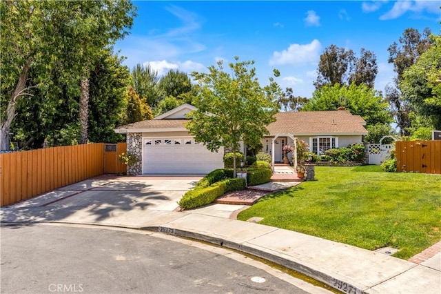 ranch-style home with an attached garage, a gate, and concrete driveway