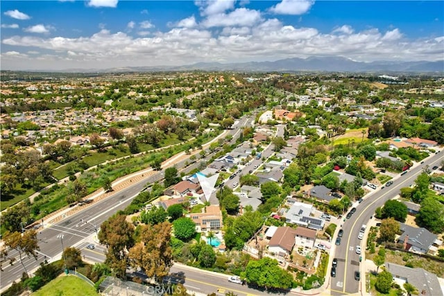 view of property location featuring nearby suburban area and mountains