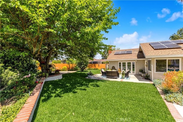 view of yard featuring a patio area, outdoor lounge area, and french doors