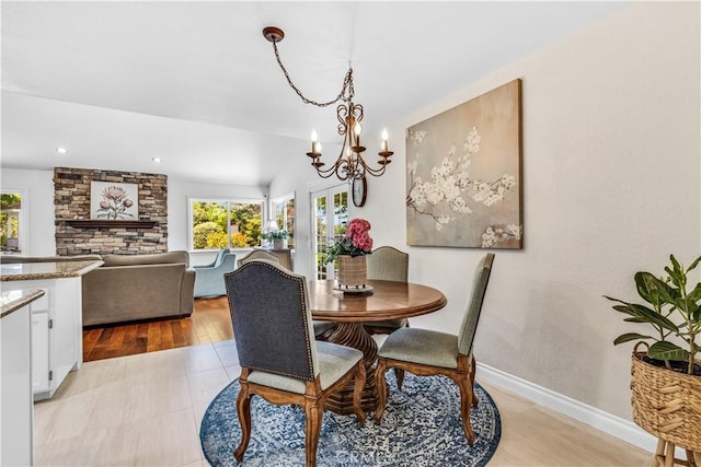 dining room with plenty of natural light, a chandelier, baseboards, light wood-style flooring, and recessed lighting