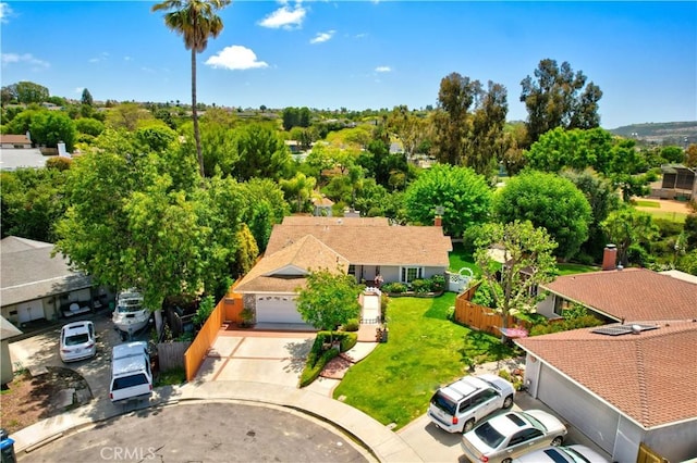 aerial view of residential area with a tree filled landscape