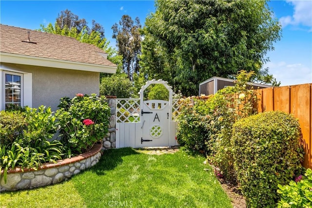 view of yard with a gate