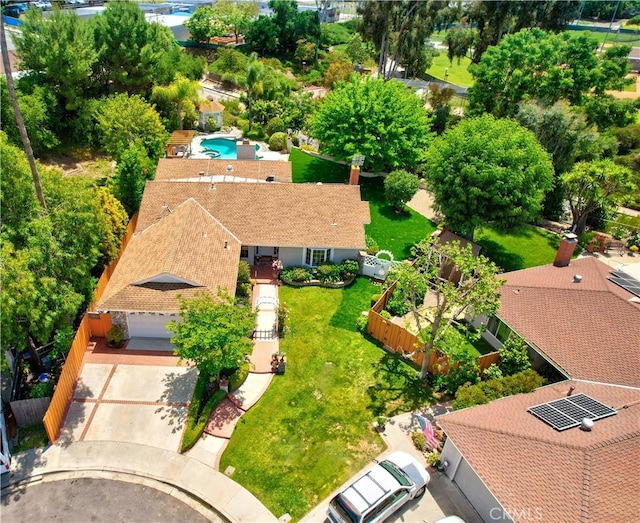 aerial view of property and surrounding area featuring a pool area