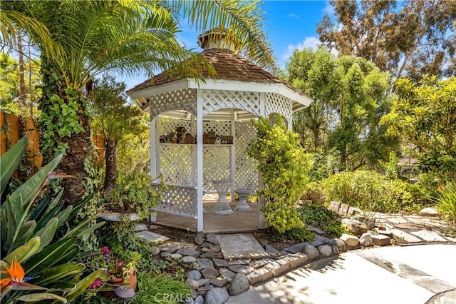 view of patio with a gazebo and fence