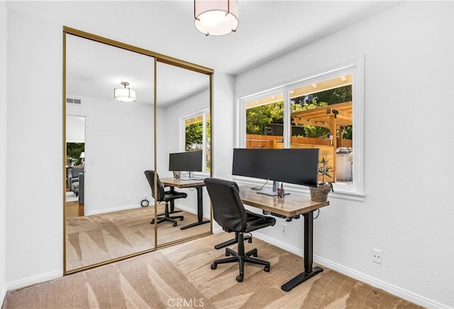 office featuring carpet floors and baseboards