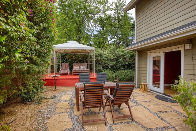 8016 Cora St, Sunland, CA 91040 - view of patio featuring a wooden deck, outdoor dining area, and a gazebo