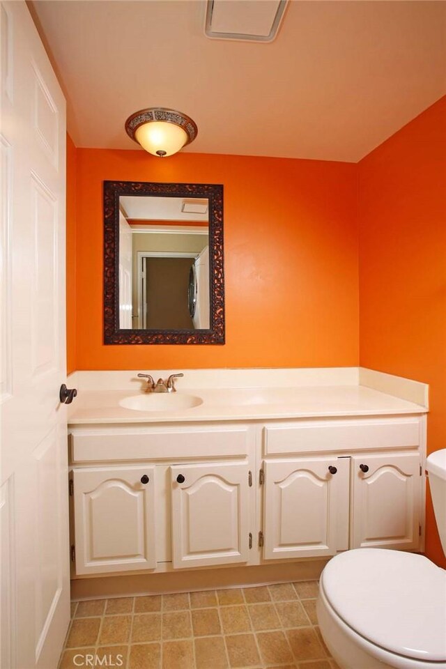 8016 Cora St, Sunland, CA 91040 - bathroom featuring toilet, vanity, and tile patterned floors