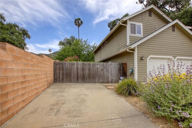 8016 Cora St, Sunland, CA 91040 - view of property exterior featuring fence and a garage