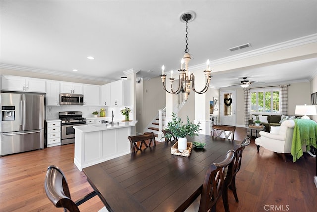 2 Anglesite, Rancho Santa Margarita, CA 92688 - dining area with ornamental molding, ceiling fan, stairway, wood finished floors, and recessed lighting