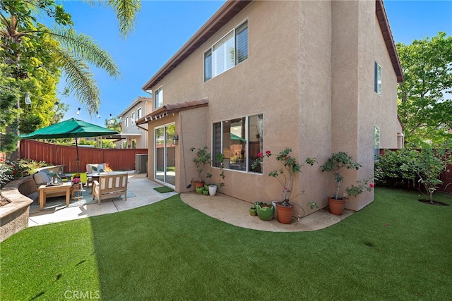 2 Anglesite, Rancho Santa Margarita, CA 92688 - back of house with stucco siding, a patio, and outdoor lounge area