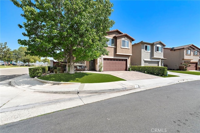 2 Anglesite, Rancho Santa Margarita, CA 92688 - view of front of house featuring stucco siding, decorative driveway, an attached garage, a tiled roof, and a residential view