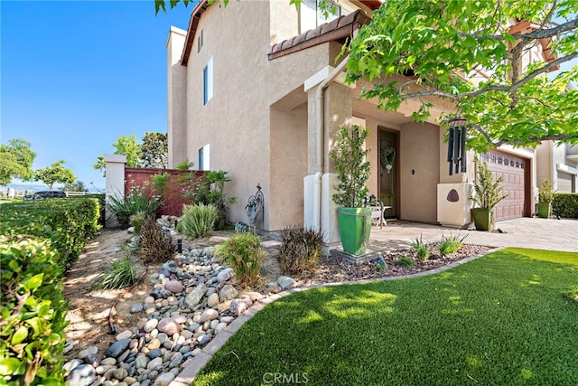2 Anglesite, Rancho Santa Margarita, CA 92688 - view of home's exterior with stucco siding, an attached garage, and driveway
