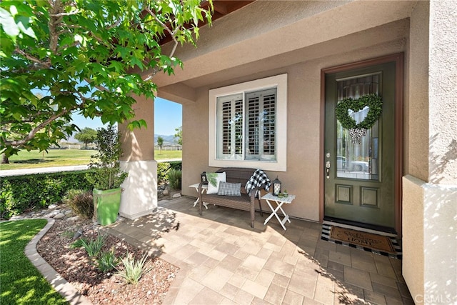 2 Anglesite, Rancho Santa Margarita, CA 92688 - view of exterior entry with stucco siding and a patio area