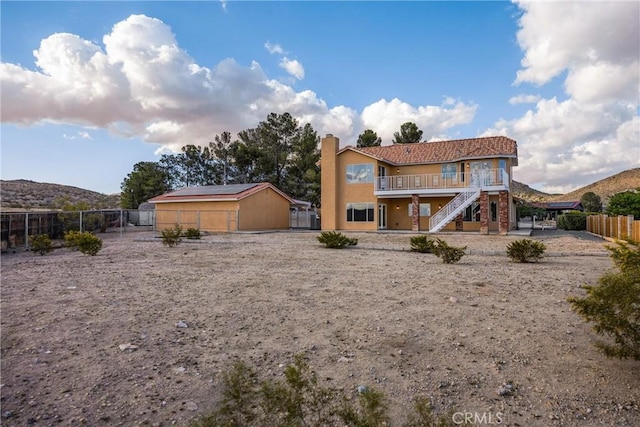 17725 Tude Ln, Apple Valley, CA 92307 - back of property with stairs, a chimney, a fenced backyard, stucco siding, and a gate