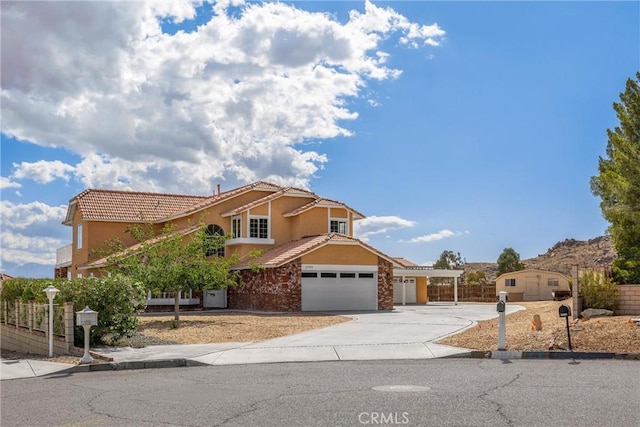 17725 Tude Ln, Apple Valley, CA 92307 - view of front of property with stucco siding, concrete driveway, a tile roof, and an attached garage