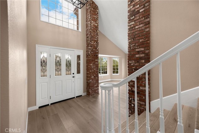 17725 Tude Ln, Apple Valley, CA 92307 - entrance foyer with wood finished floors, stairway, a high ceiling, and baseboards
