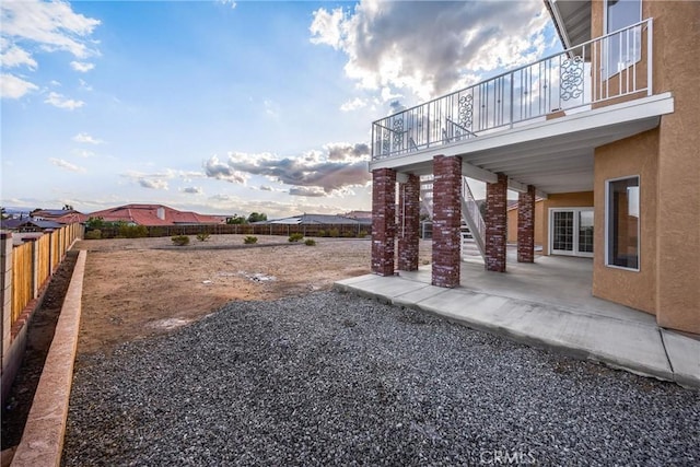 17725 Tude Ln, Apple Valley, CA 92307 - fenced backyard with a patio area, stairway, and a balcony