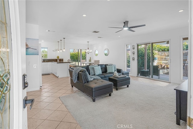 74216 Myrsine Ave, Palm Desert, CA 92260 - living room with light tile patterned floors, a ceiling fan, a chandelier, and recessed lighting