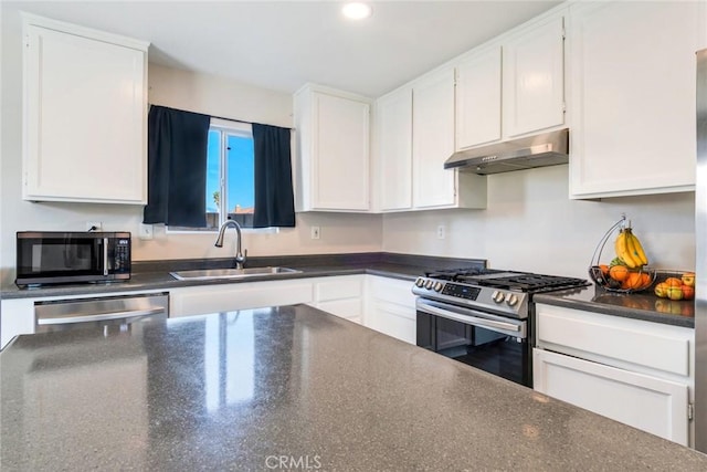 1113 Juniper Ct, San Jacinto, CA 92582 - kitchen featuring appliances with stainless steel finishes, under cabinet range hood, a sink, white cabinetry, and recessed lighting