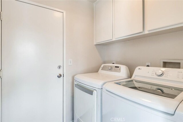 1113 Juniper Ct, San Jacinto, CA 92582 - laundry area with washer and clothes dryer and cabinet space