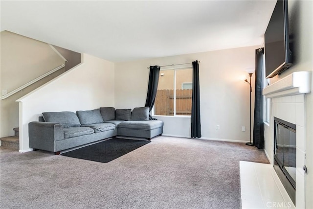 1113 Juniper Ct, San Jacinto, CA 92582 - carpeted living area featuring stairway, a fireplace with flush hearth, and baseboards