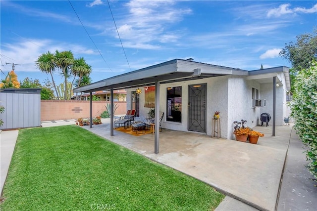 3235 Faust Ave, Long Beach, CA 90808 - rear view of property featuring a patio area, stucco siding, a shed, and an outbuilding