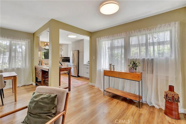 3235 Faust Ave, Long Beach, CA 90808 - interior space with light wood finished floors and baseboards