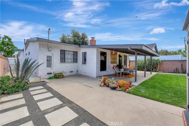 3235 Faust Ave, Long Beach, CA 90808 - rear view of property with stucco siding, a patio, a chimney, and crawl space