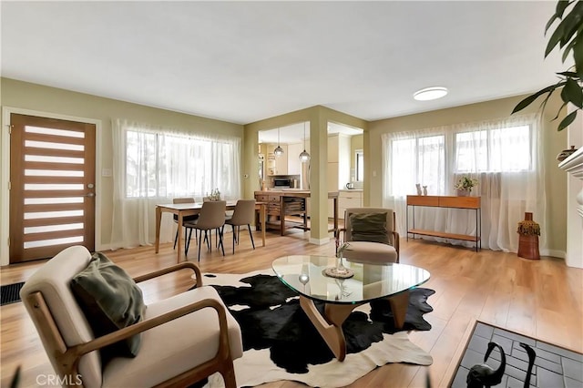 3235 Faust Ave, Long Beach, CA 90808 - living room with light wood-style flooring and baseboards