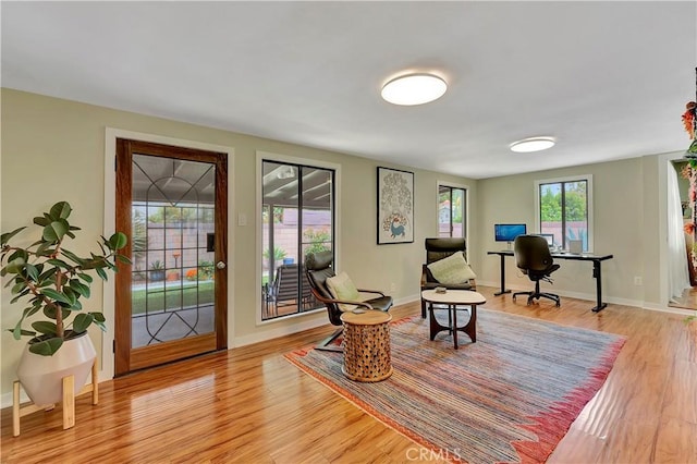 3235 Faust Ave, Long Beach, CA 90808 - living area with light wood finished floors, baseboards, and an office area