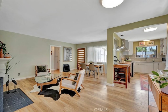 3235 Faust Ave, Long Beach, CA 90808 - living area with light wood-style floors and baseboards