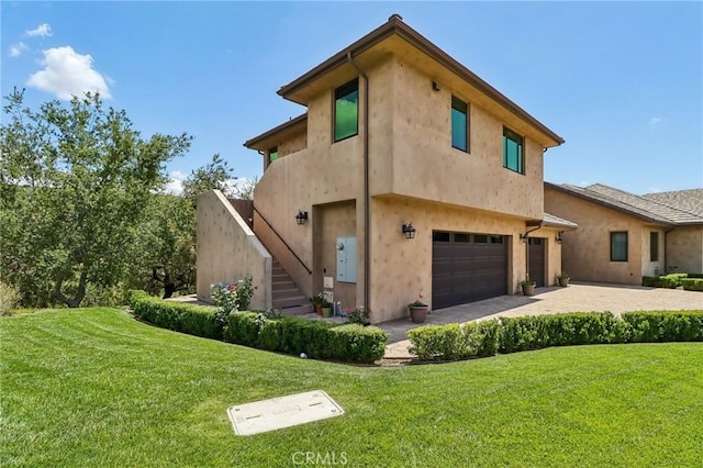 4004 Snowgoose St, Simi Valley, CA 93065 - view of side of property with a garage, stairs, a lawn, and stucco siding