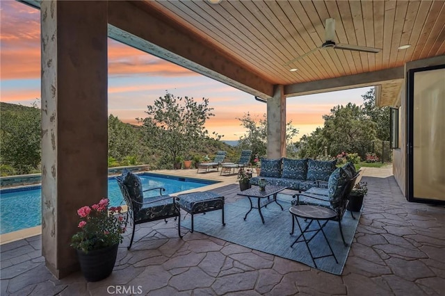4004 Snowgoose St, Simi Valley, CA 93065 - patio terrace at dusk with ceiling fan, outdoor lounge area, and an outdoor pool