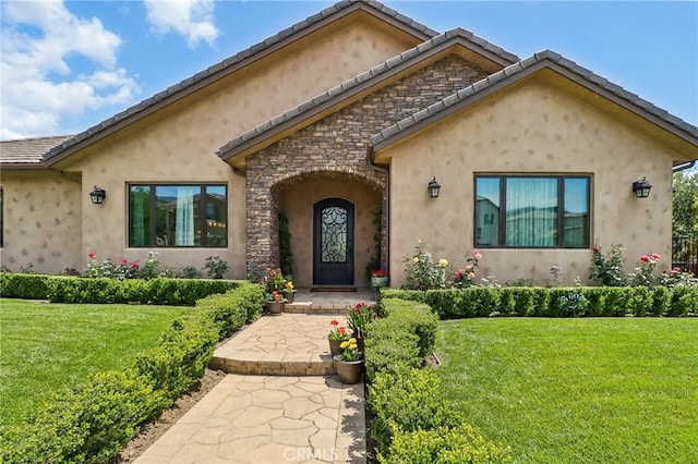 4004 Snowgoose St, Simi Valley, CA 93065 - view of front of home with a front lawn, stucco siding, stone siding, and a tile roof