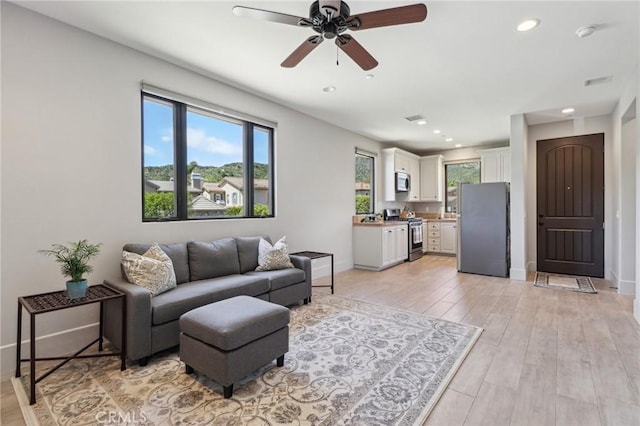 4004 Snowgoose St, Simi Valley, CA 93065 - living area featuring a ceiling fan, recessed lighting, light wood-style flooring, and baseboards