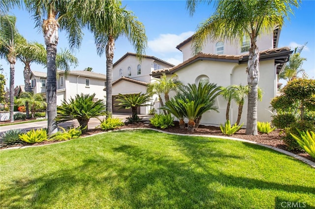 32429 Castle Ct, Temecula, CA 92592 - mediterranean / spanish-style home featuring a front yard, stucco siding, an attached garage, a tiled roof, and concrete driveway