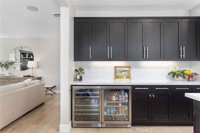 32429 Castle Ct, Temecula, CA 92592 - indoor dry bar featuring wine cooler and light wood-style floors