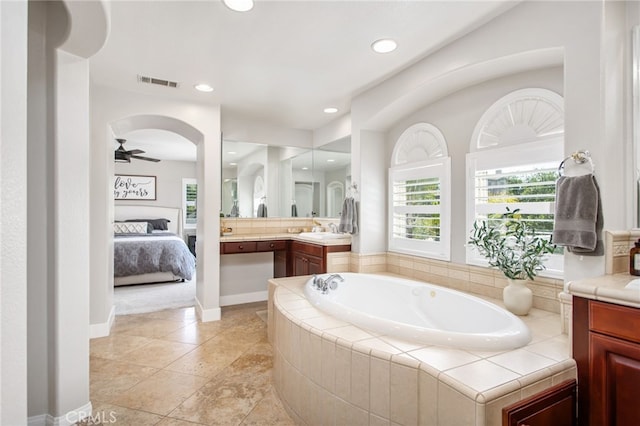 32429 Castle Ct, Temecula, CA 92592 - ensuite bathroom featuring vanity, a garden tub, ceiling fan, and recessed lighting
