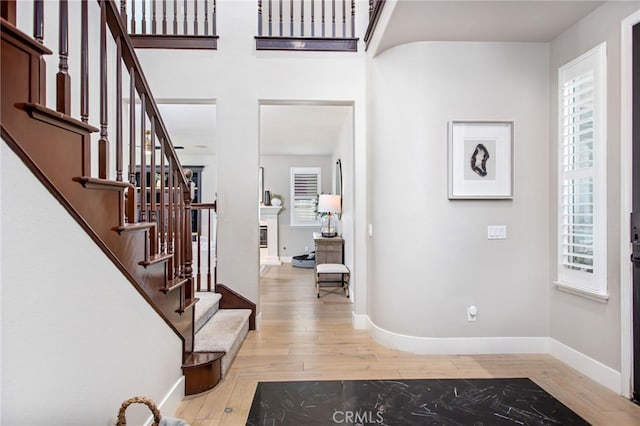 32429 Castle Ct, Temecula, CA 92592 - foyer entrance with hardwood / wood-style floors, healthy amount of natural light, and stairway