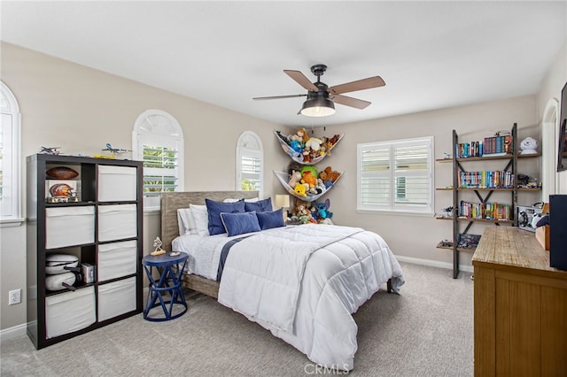 32429 Castle Ct, Temecula, CA 92592 - bedroom with light carpet, multiple windows, and a ceiling fan