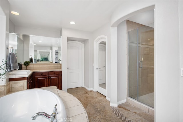 32429 Castle Ct, Temecula, CA 92592 - full bathroom with a stall shower, vanity, a bath, and recessed lighting