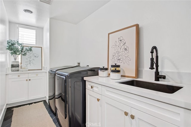 32429 Castle Ct, Temecula, CA 92592 - laundry area with separate washer and dryer and cabinet space