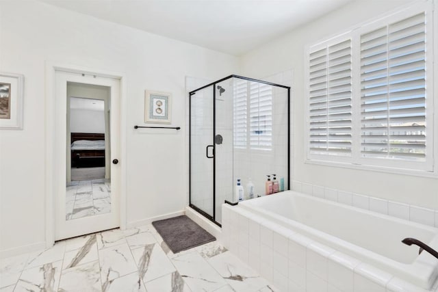 4203 Calle Del Vis, Oceanside, CA 92057 - bathroom with marble finish flooring, a bath, ensuite bath, a shower stall, and baseboards