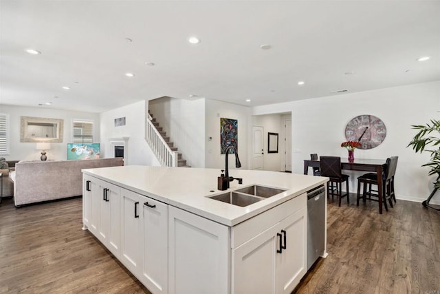 4203 Calle Del Vis, Oceanside, CA 92057 - kitchen with a sink, open floor plan, stainless steel dishwasher, wood finished floors, and a kitchen island with sink