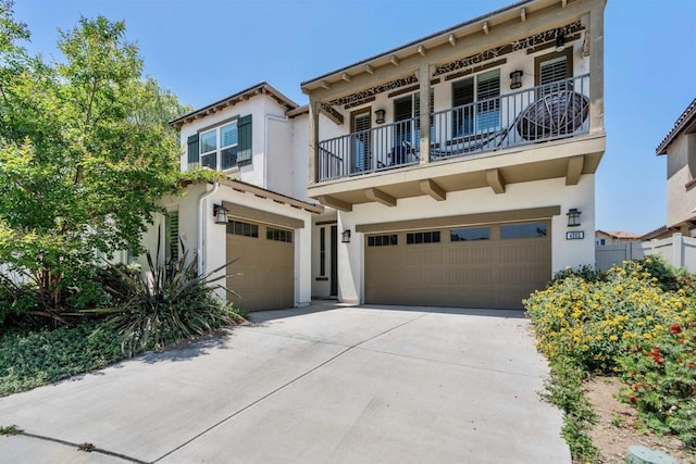 4203 Calle Del Vis, Oceanside, CA 92057 - view of front of house with a balcony, stucco siding, an attached garage, and driveway