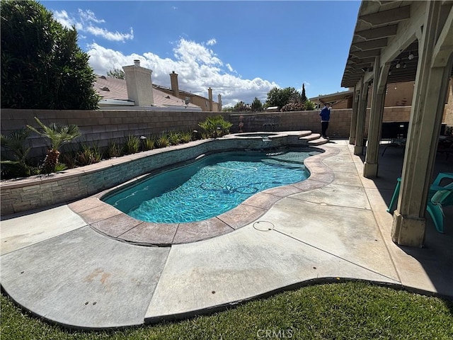 1800 Windermere Dr, Lancaster, CA 93534 - view of swimming pool featuring a patio area, a fenced backyard, and a pool with connected hot tub