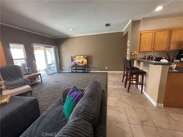 1800 Windermere Dr, Lancaster, CA 93534 - living area with crown molding, light tile patterned floors, recessed lighting, and baseboards