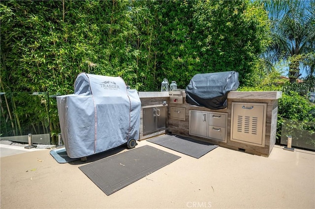 29784 Nautical Ct, Canyon Lake, CA 92587 - view of patio with an outdoor kitchen and a grill